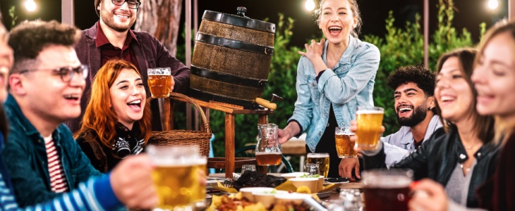 A small group of professionals enjoy happy hour at a brewery