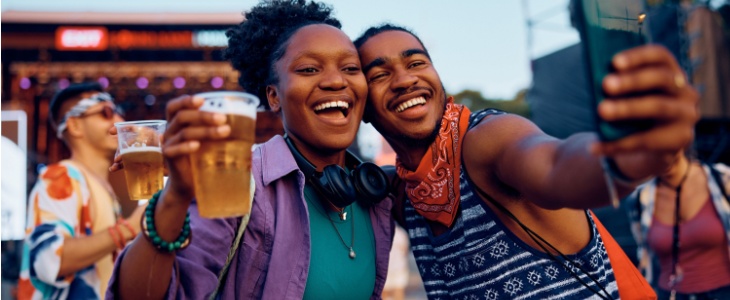 a young couple enjoys a festival downtown